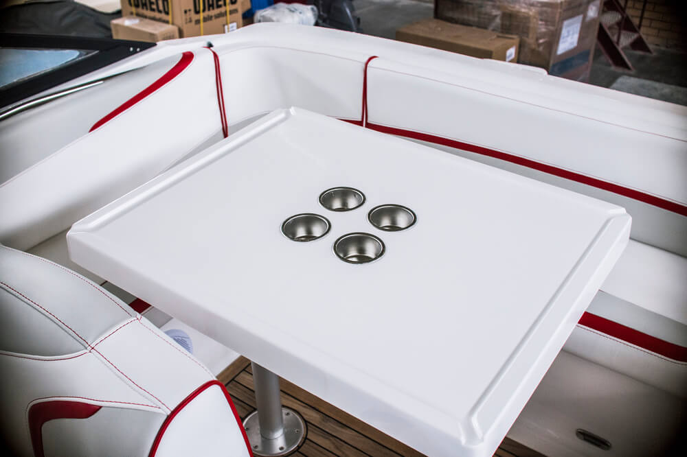 Cockpit table with four stainless steel cup holders
